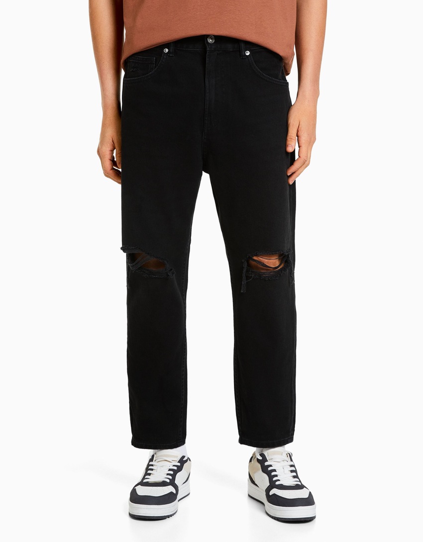 Calça jeans folgada com rasgos