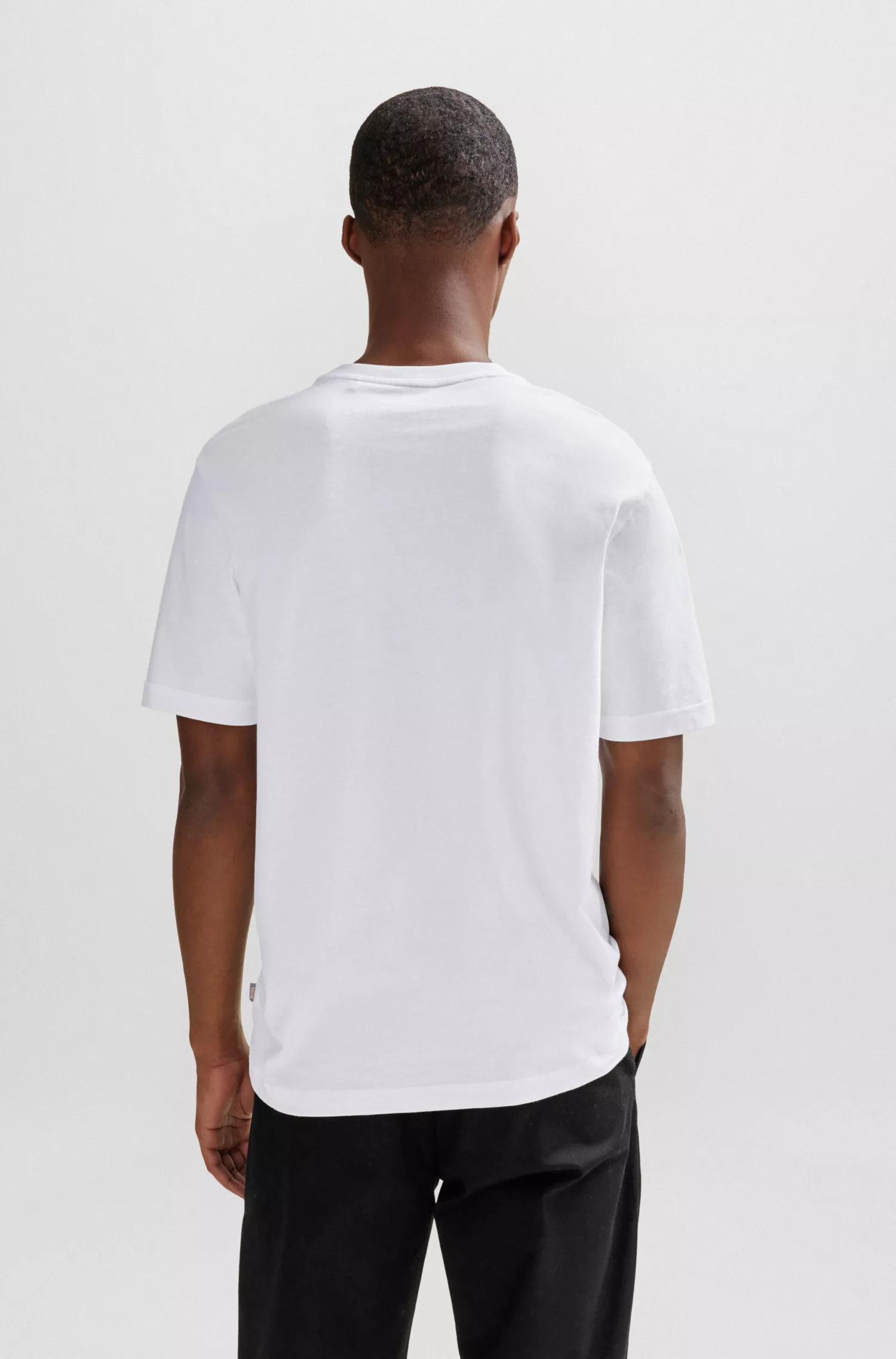 Camiseta BOSS laranja em malha de algodão com estampa sazonal.