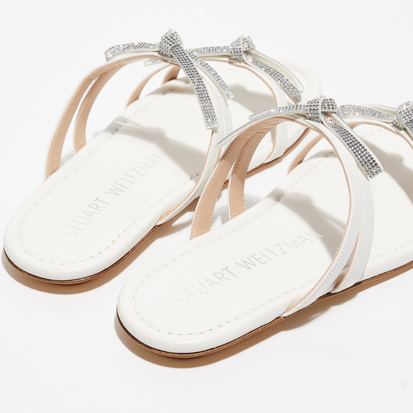 Stuart Weitzman Mules en Cuir Bow crème