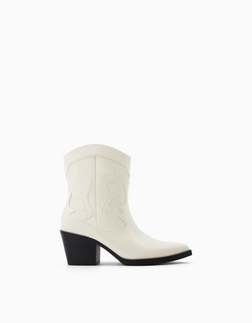 Botas de cowboy com salto alto