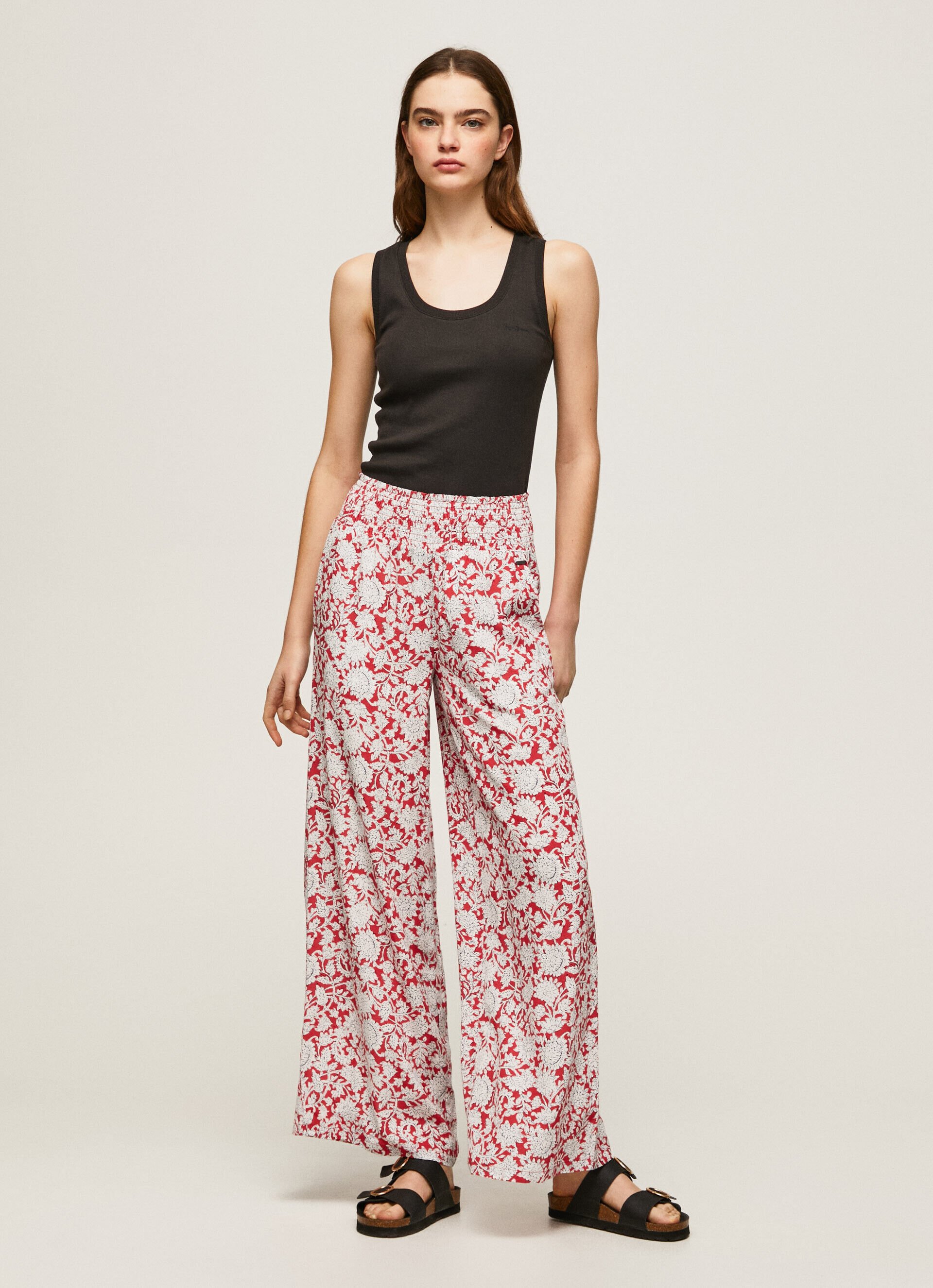 Calça de perna larga com estampa floral - multicolorida
