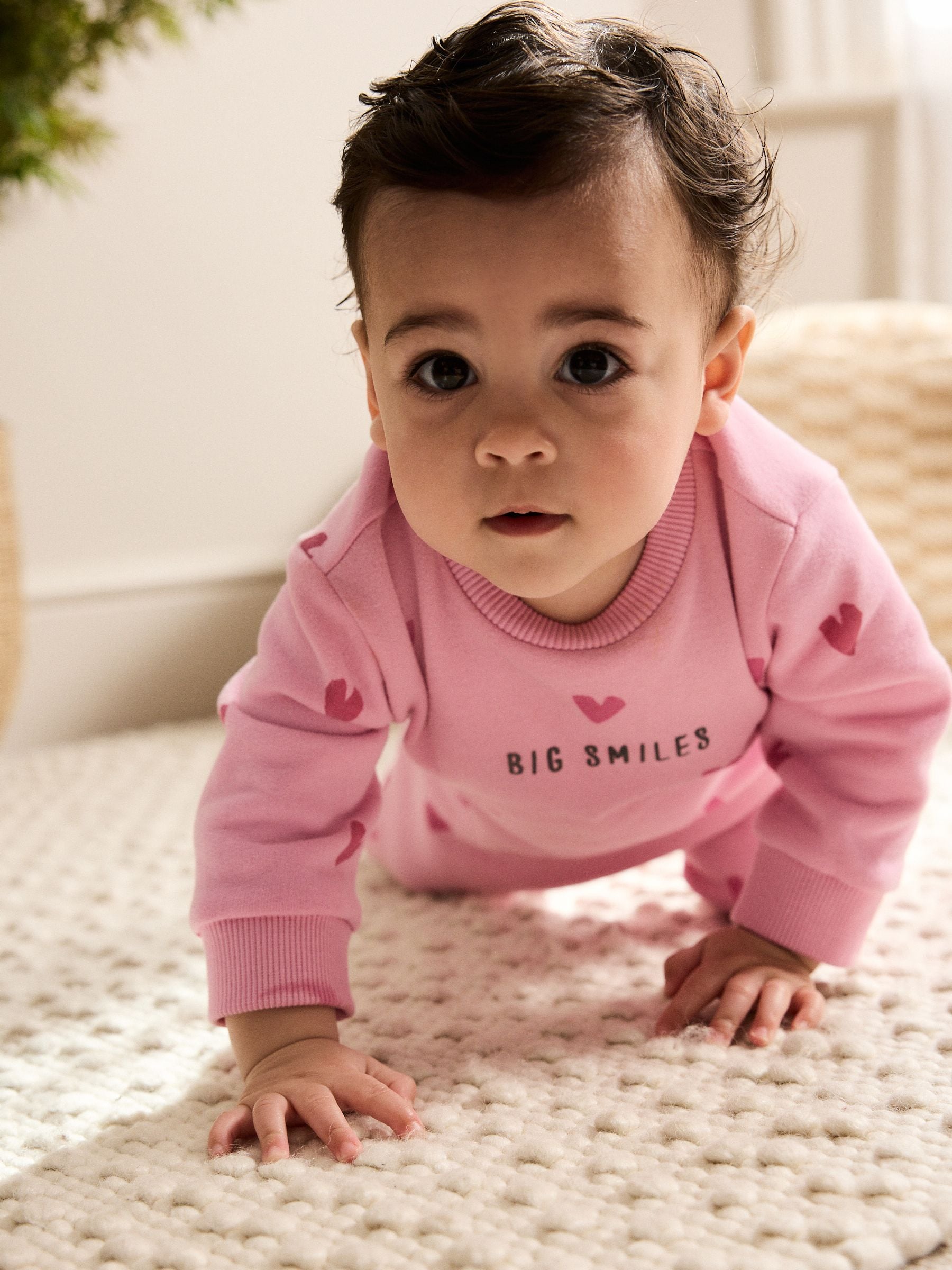 Roze met hartjesprint - Jersey babyromper (0mnd-3jr)
