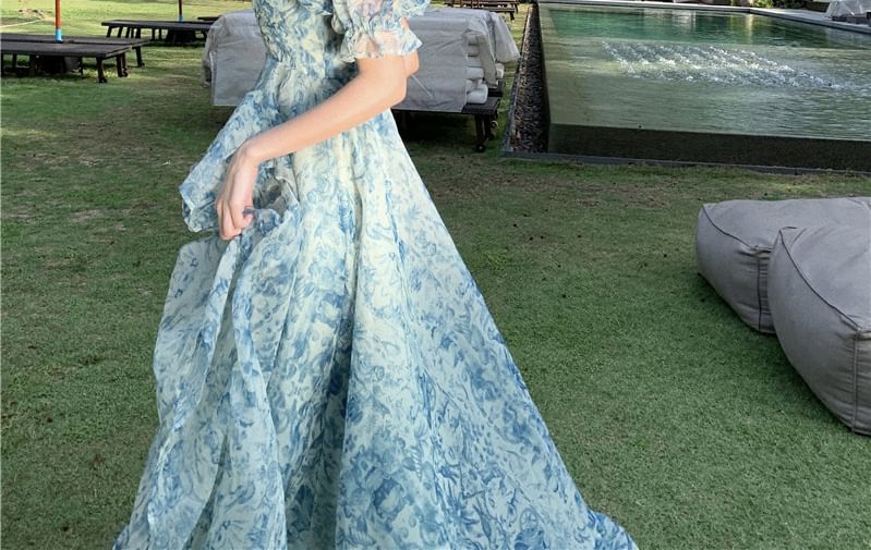 Odestra - Maxi A-lijn jurk met pofmouwen en off-shoulder bloemenprint