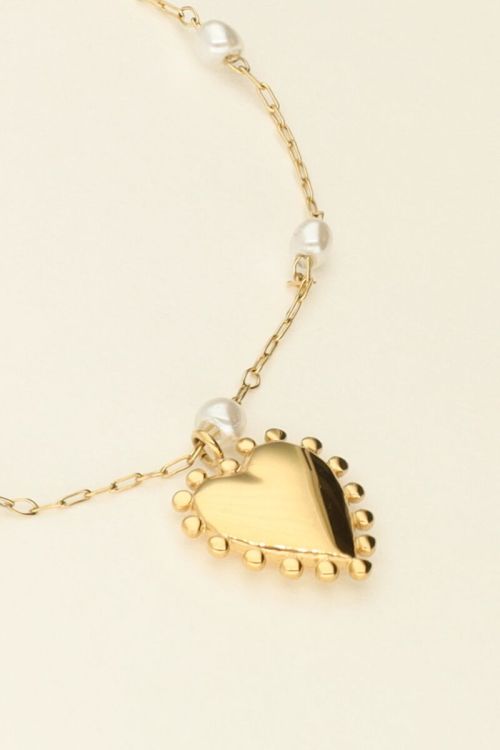 Armband met hartjes bedel en parels