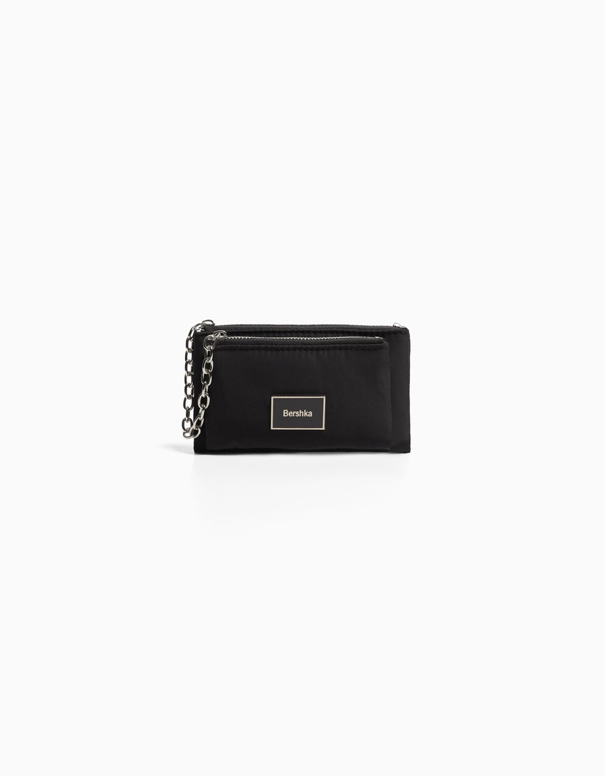 Bolsa com fecho duplo e corrente.