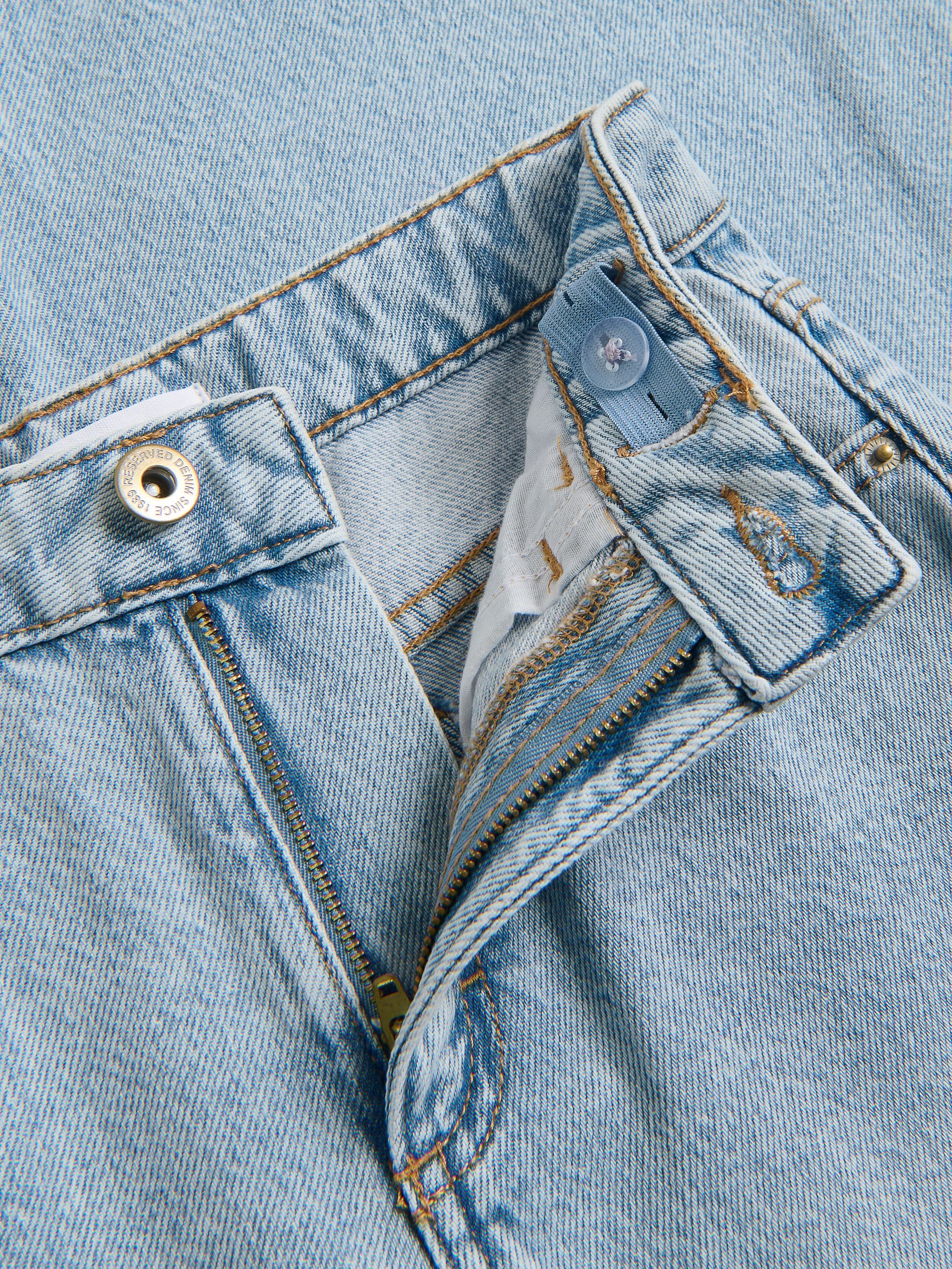 Weitbein-Jeans mit Applikationen