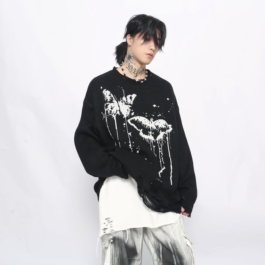 Derbundy - Oversized trui met ronde hals en vlinderprint