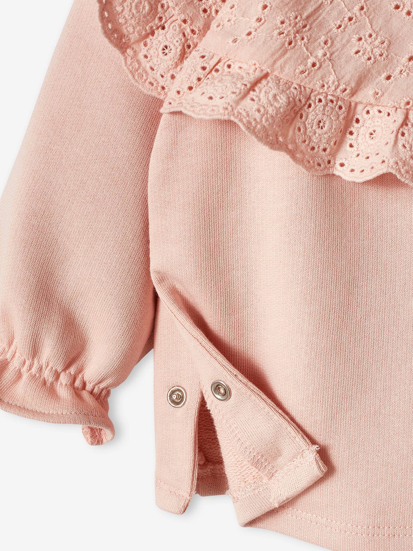 Blusa de moletom rosa bebê com gola bordada.