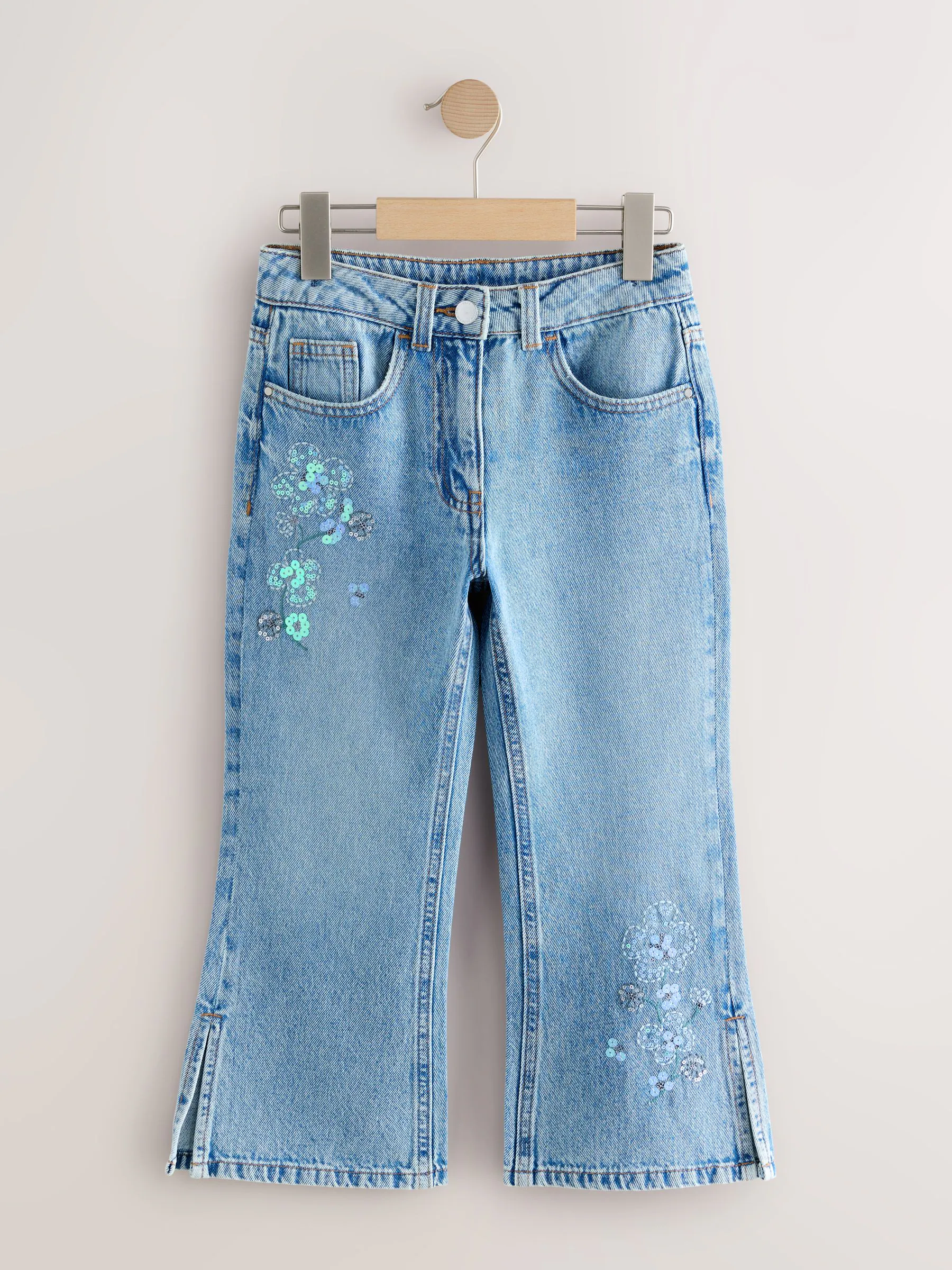 Lichtblauwe denim - Flare jeans met bloemenversiering (3-16jaar)