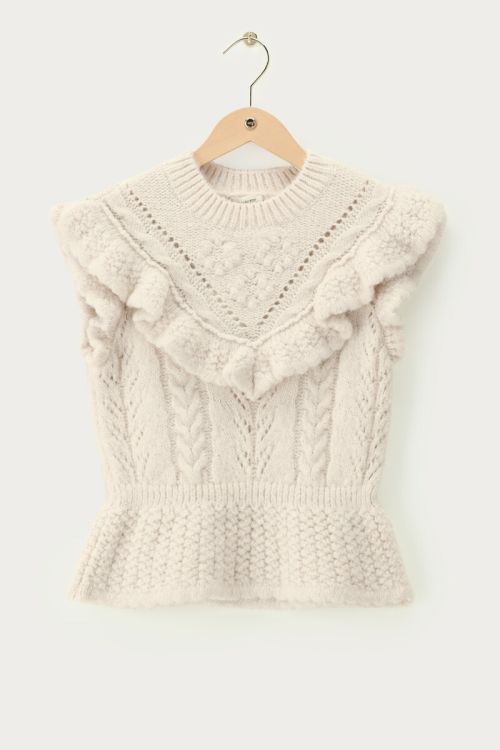Beige spencer met ajour en ruffles