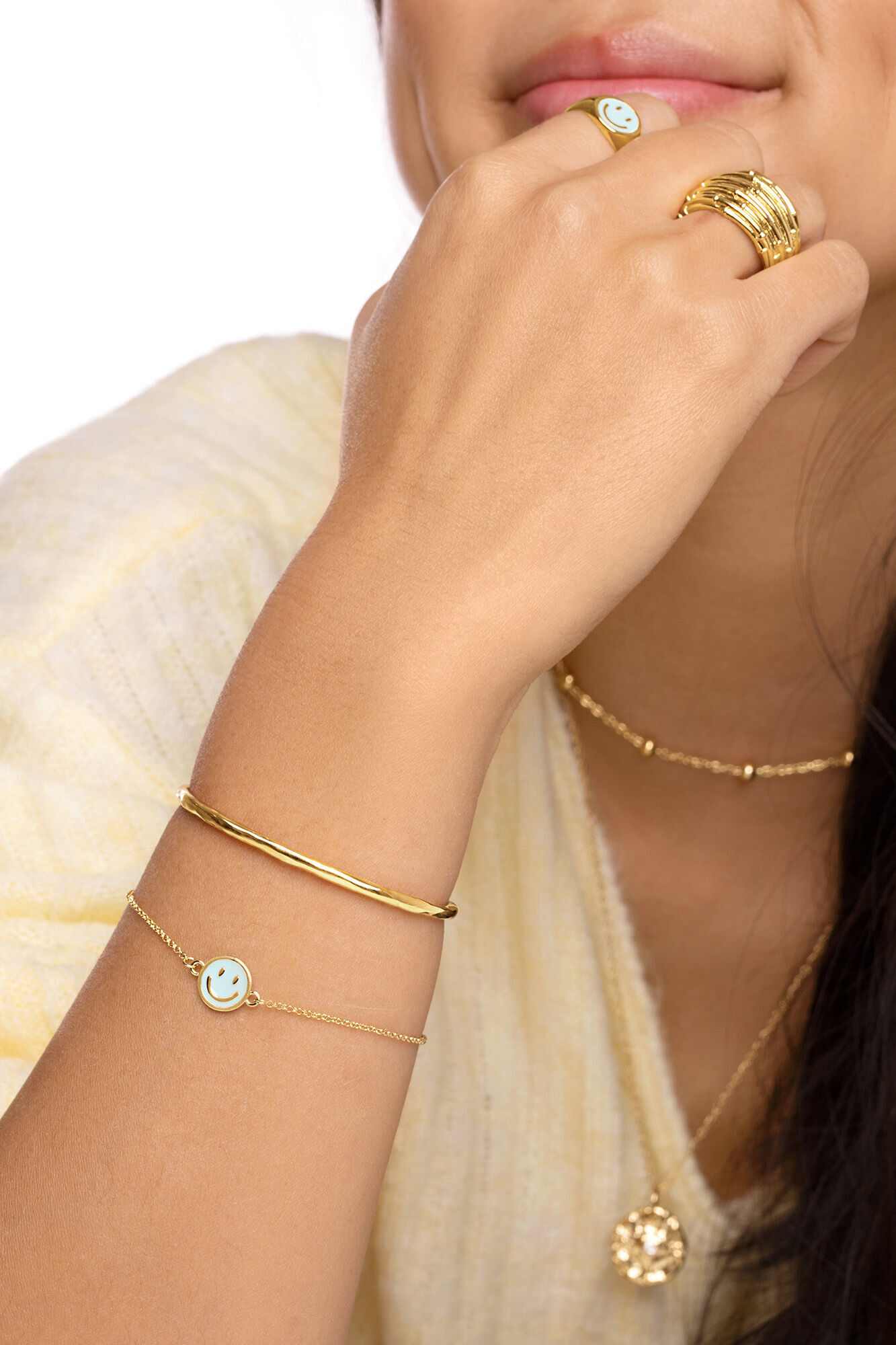 Pulseira Smiley Sky em esmalte dourado