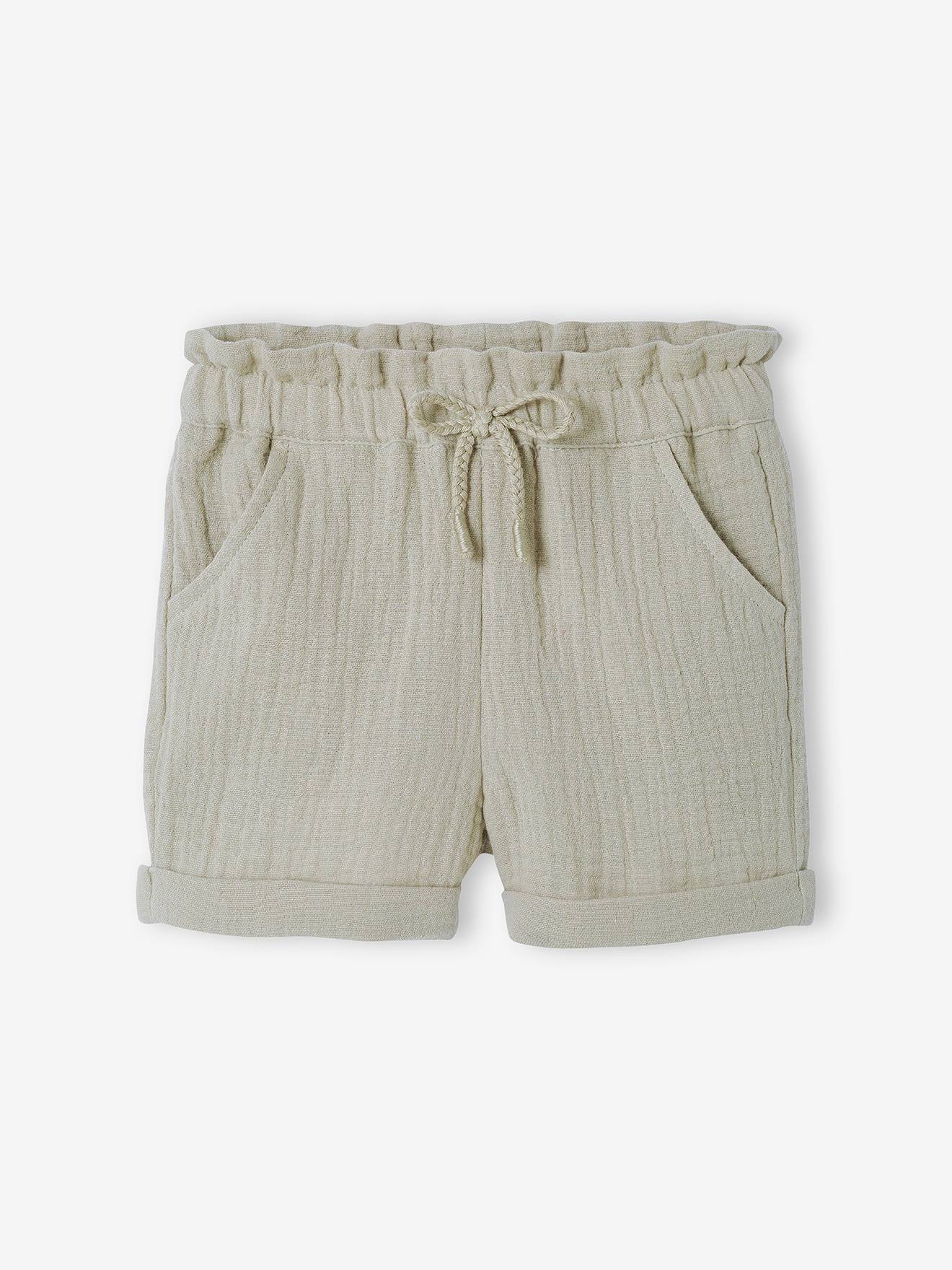 Calções de bebé com cintura elástica em chiffon de algodão liso cor laranja claro.