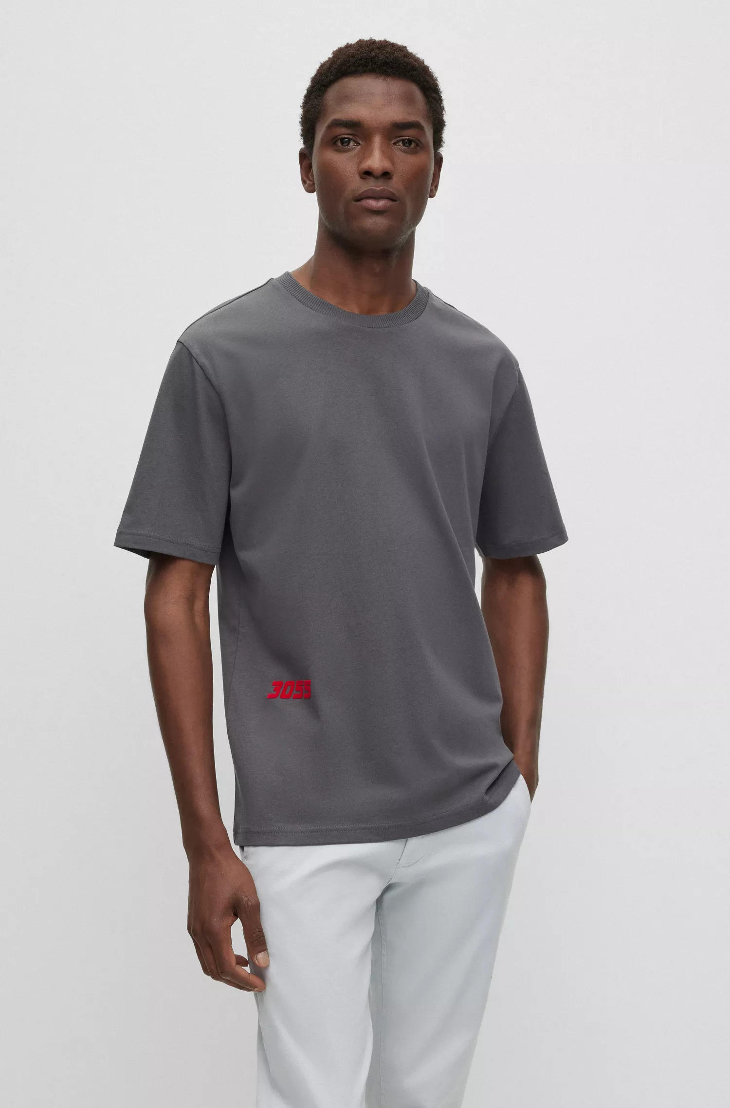 Camiseta BOSS laranja, modelagem relaxada, em algodão com estampa inspirada em corridas.
