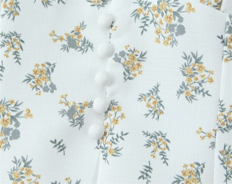 Avauntgardo - Halter V-hals bloemenprint kanten rand open rug mini A-lijn jurk