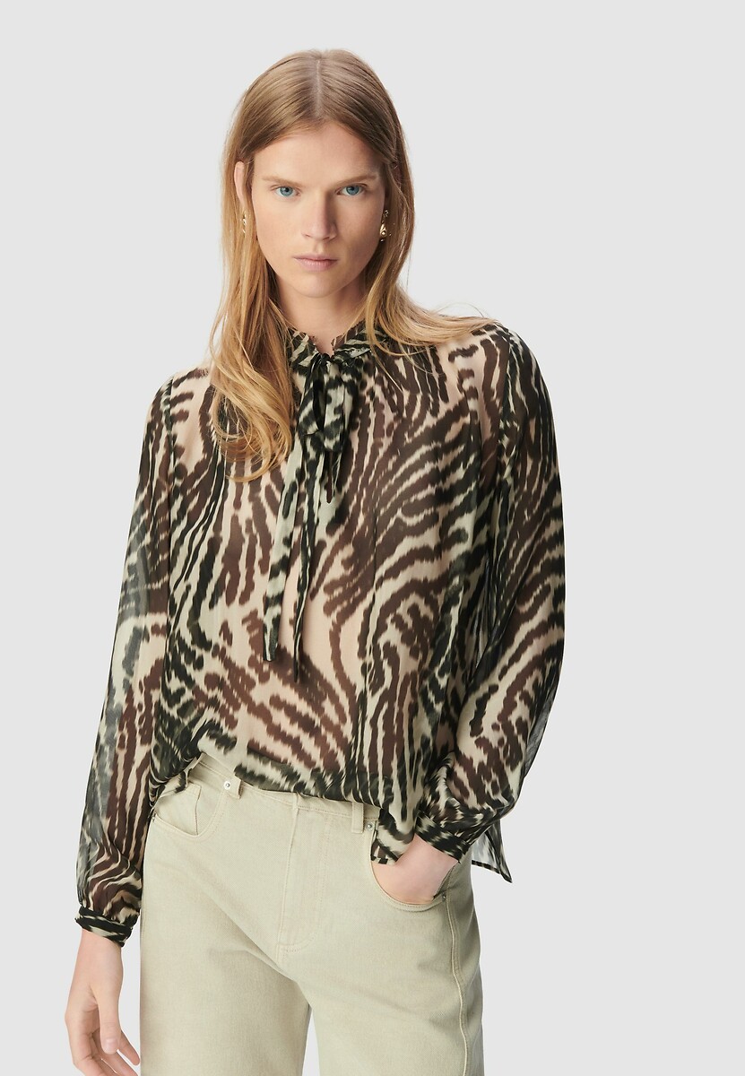 Blusa de manga comprida IKKS com estampa de zebra e laço no pescoço.