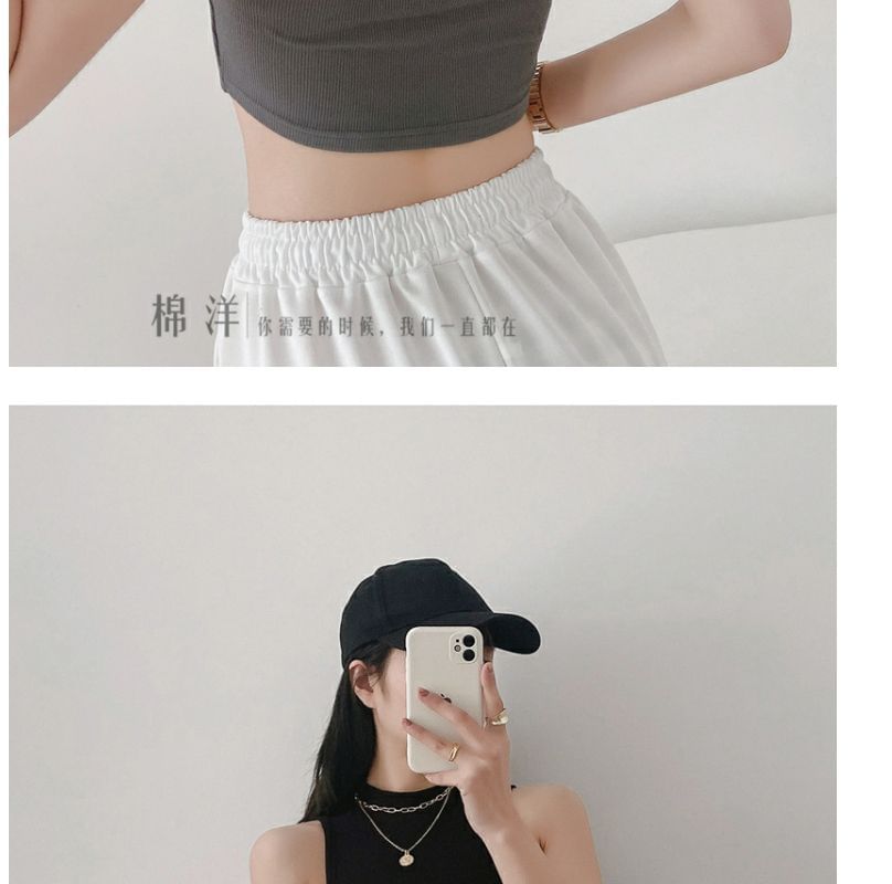 Hevnir - Tanktop met lage hals en effen crop top
