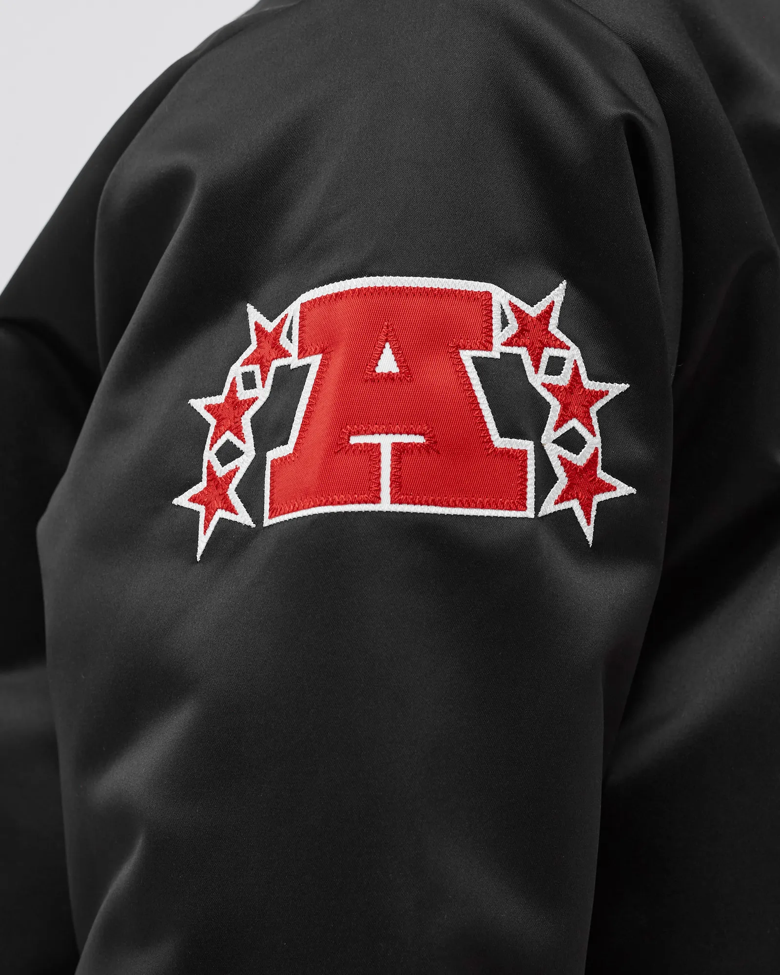 Jaqueta Mitchell & Ness NFL de cetim pesado - Oakland Raiders
