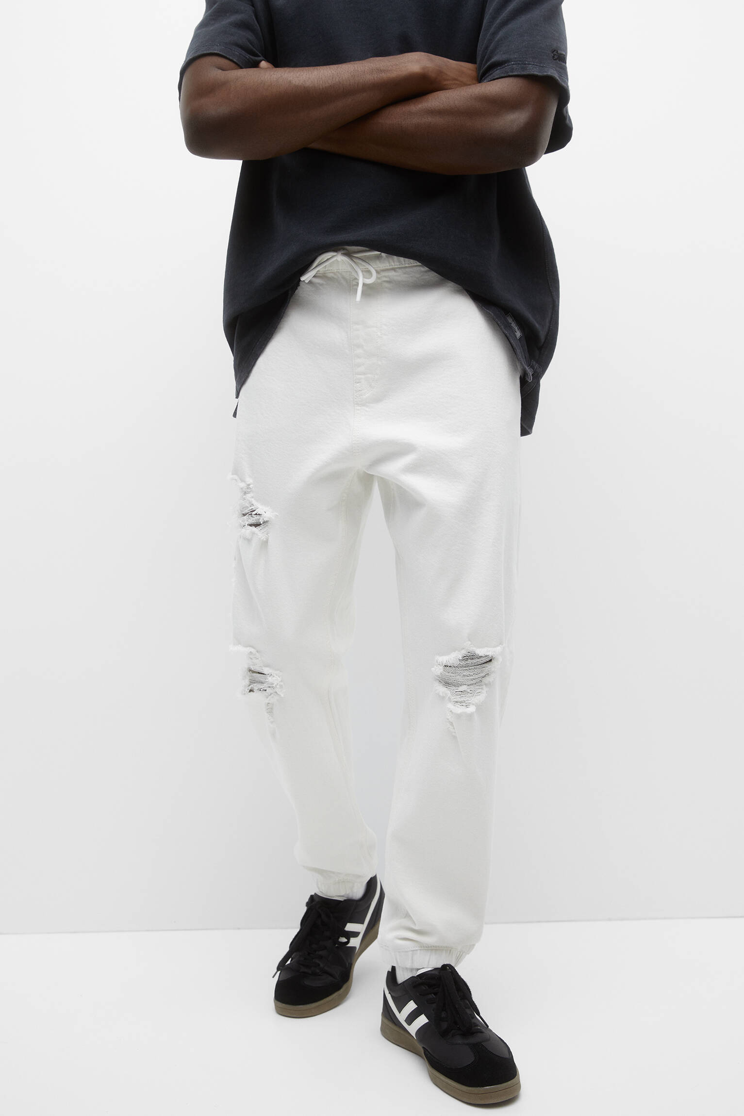 Calça jeans jogger rasgada - branca