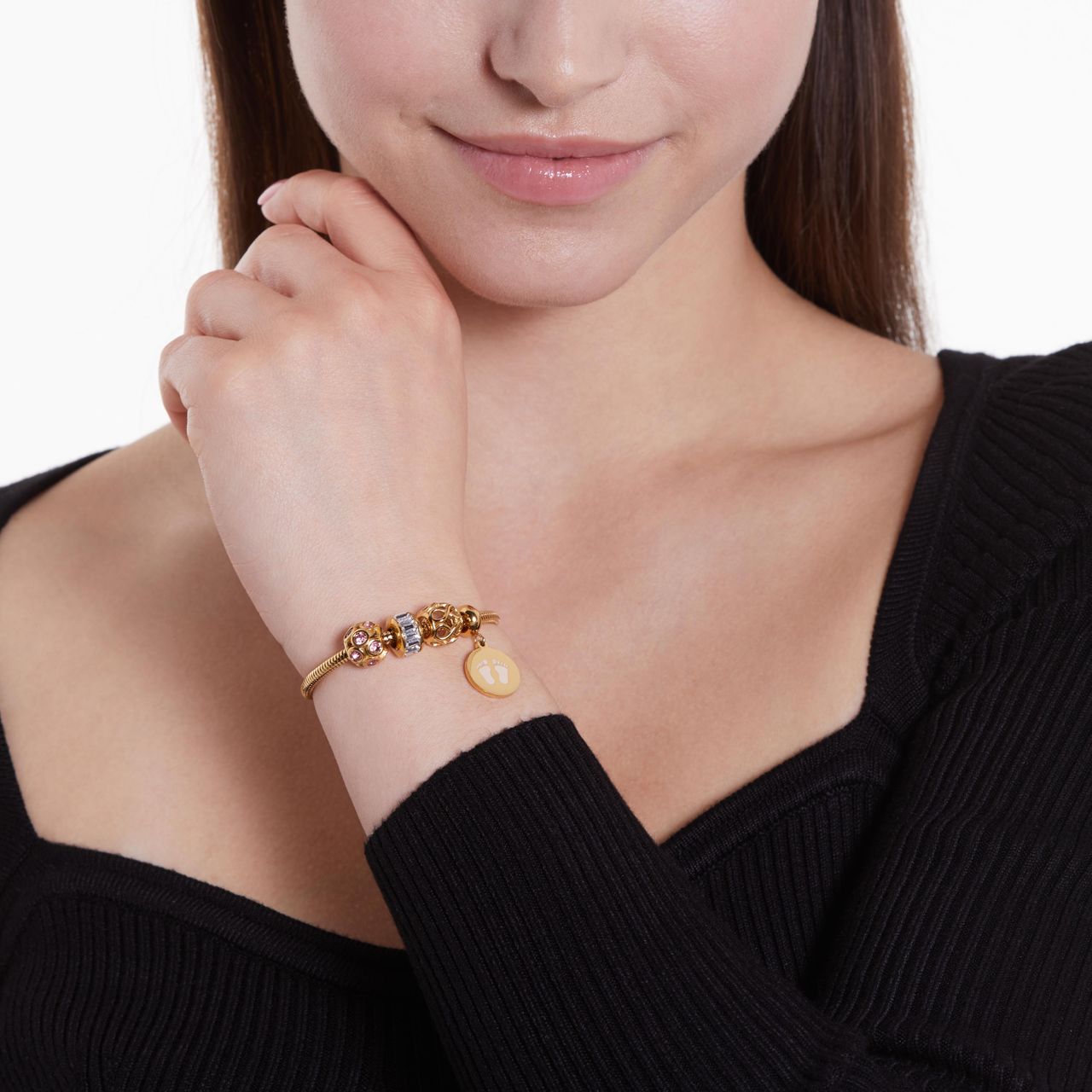 Stalen goldplated bedel bol met roze zirkonia