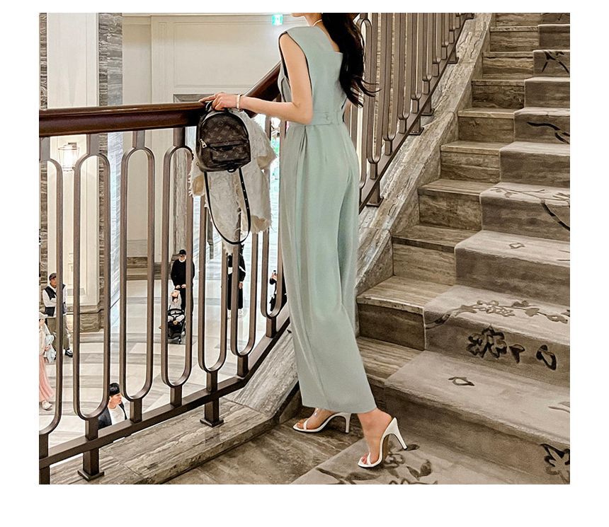 Arabesquito - Mouwloze jumpsuit met wijde pijpen en effen stof
