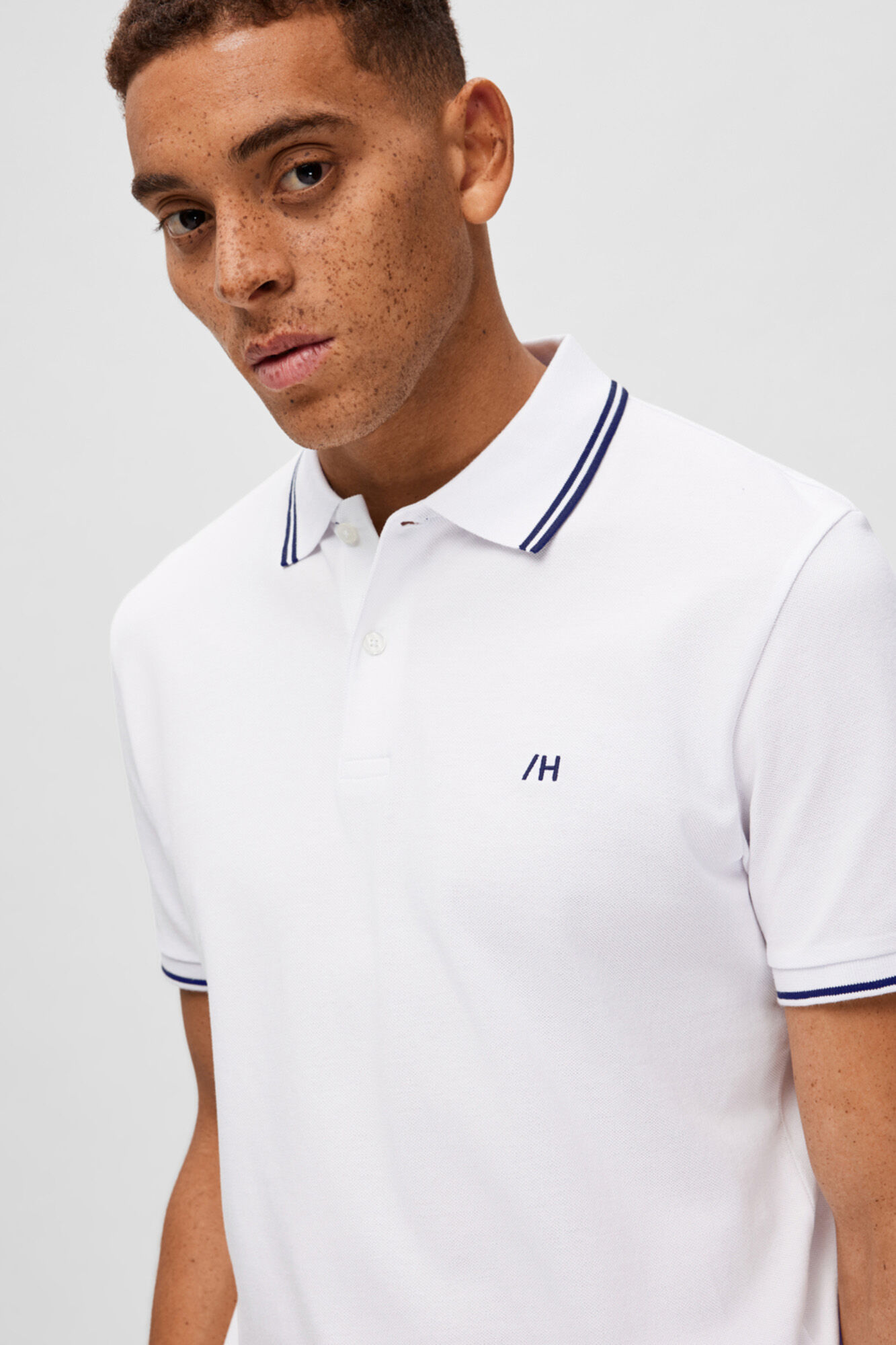 Camisa polo 100% algodão orgânico com logotipo bordado - Branca