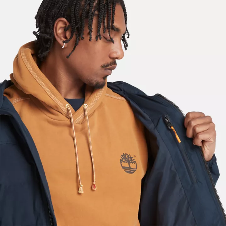 Jaqueta puffer impermeável com capuz Mountain Welch para homens na cor azul marinho.
