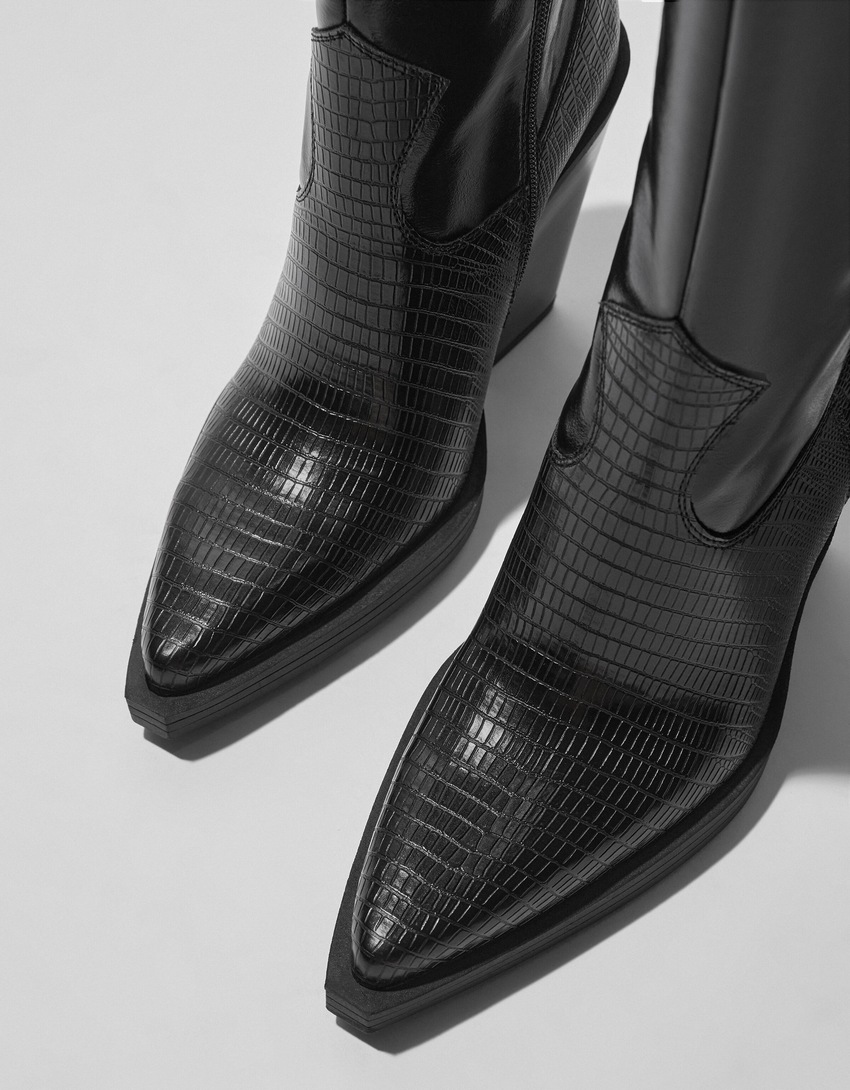 Botas de cowboy com salto alto