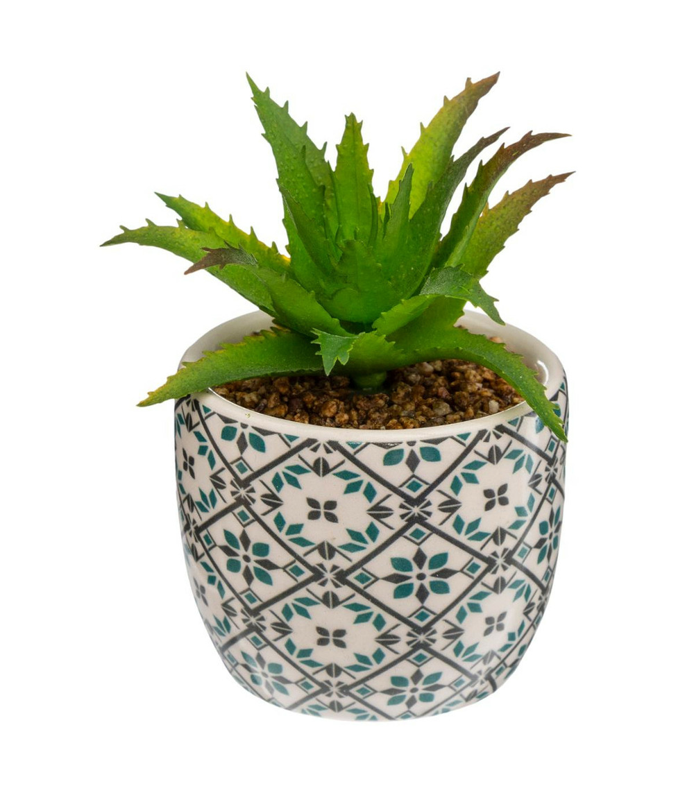 Plante artificielle verte dans un pot en céramique