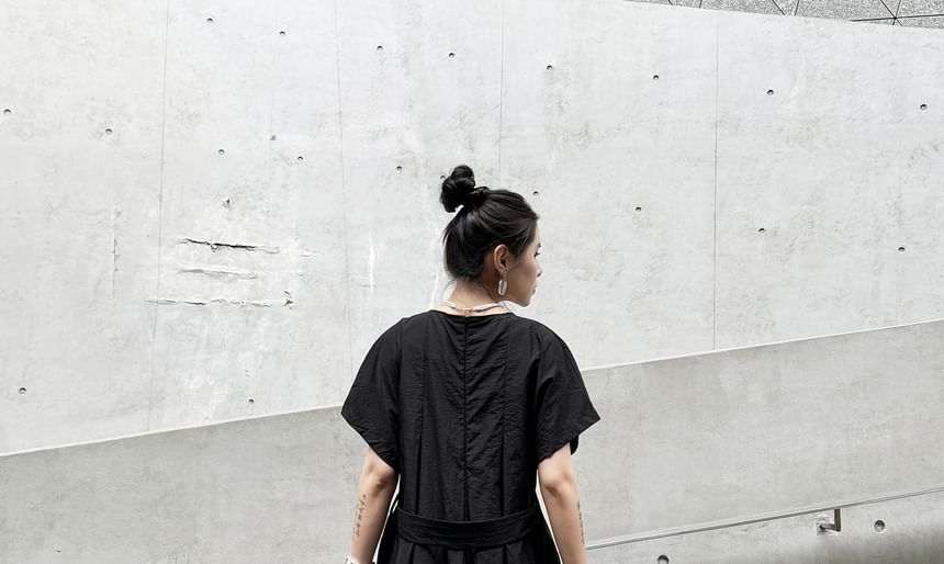 KUMI - Jumpsuit met korte mouwen en wijde pijpen
