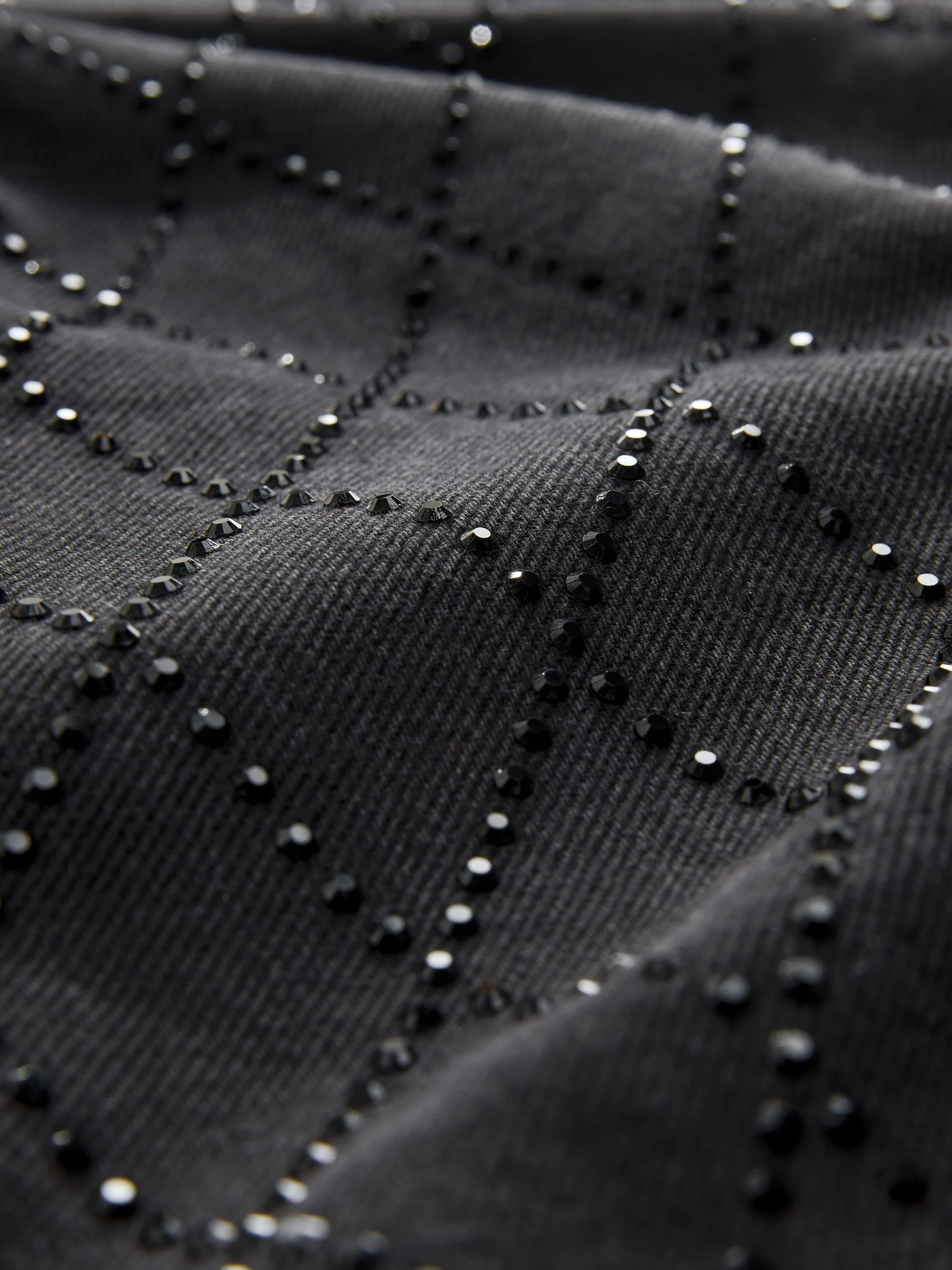 Zwart met sierstiksel - Jeans met wijde pijpen