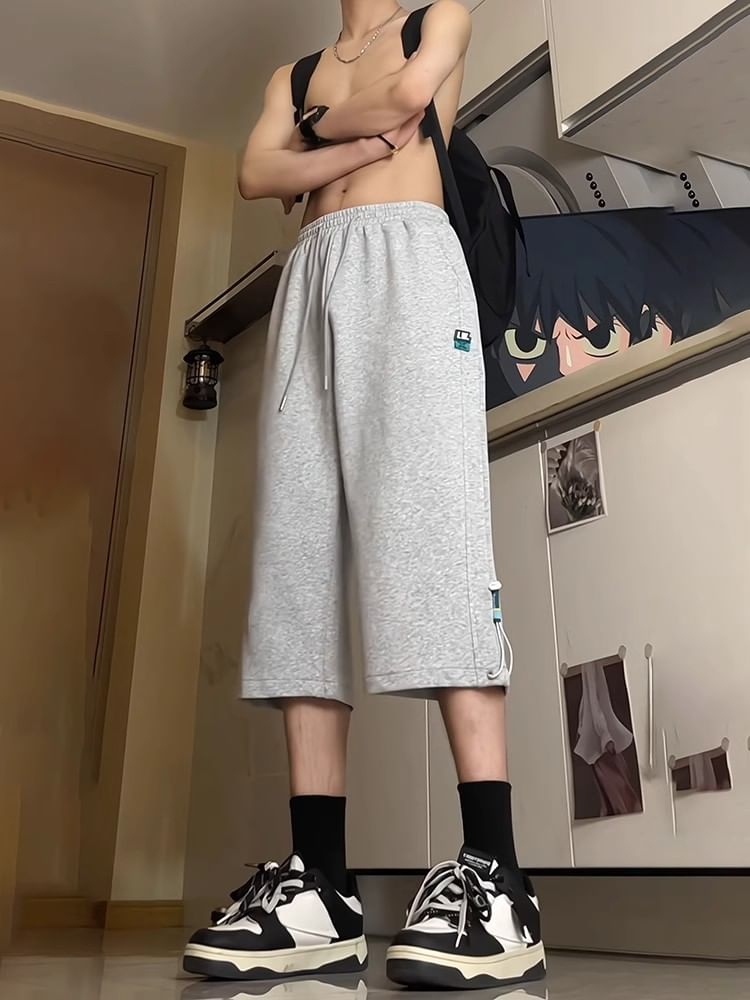 Posive - Capri-joggingbroek met trekkoord in de taille en applicatie