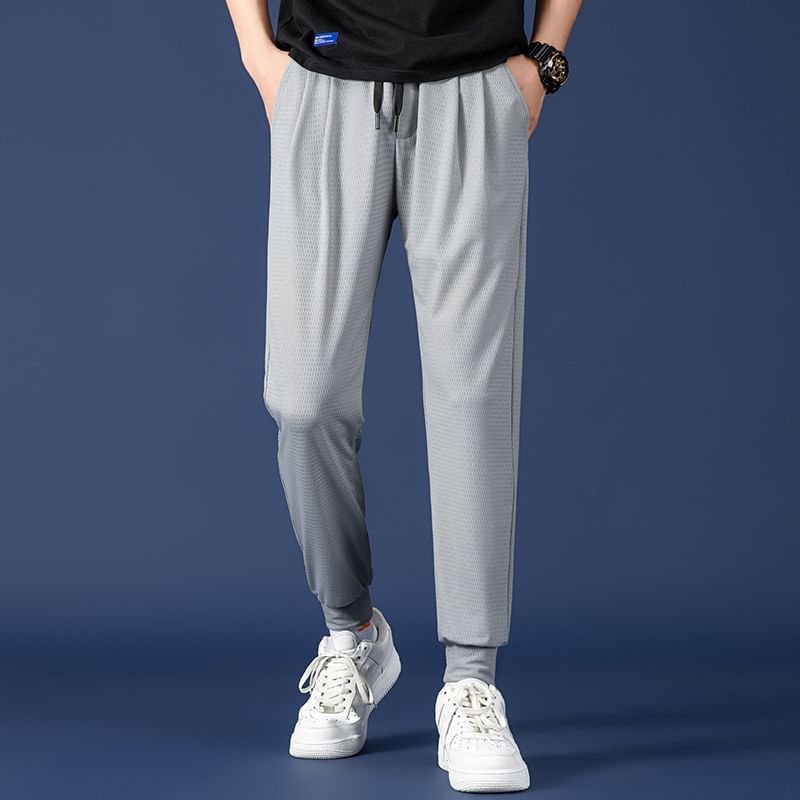 Acrius - Effen cropped harembroek met trekkoordtaille