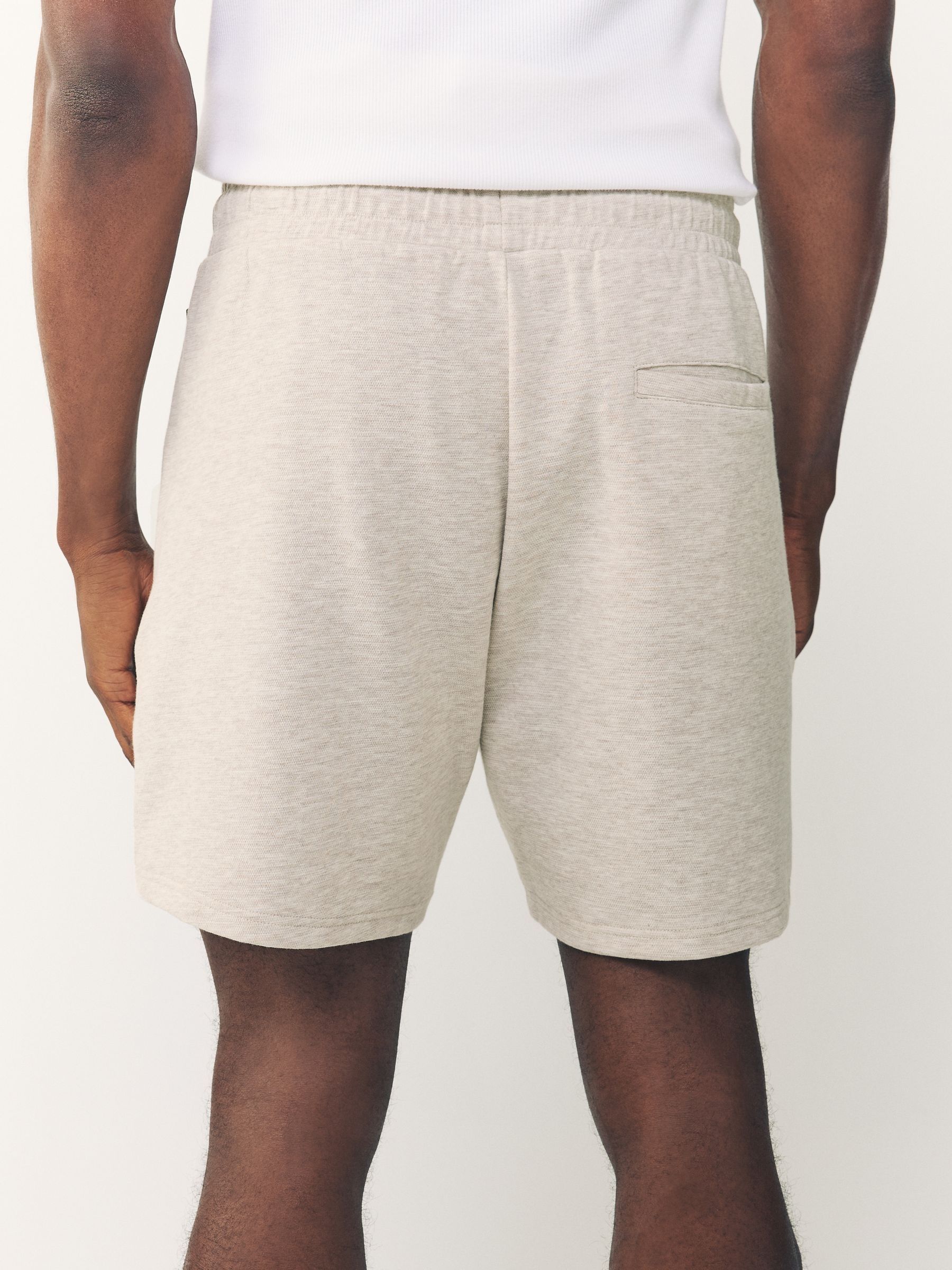 Gemêleerd naturel - Jersey shorts met ritszakje