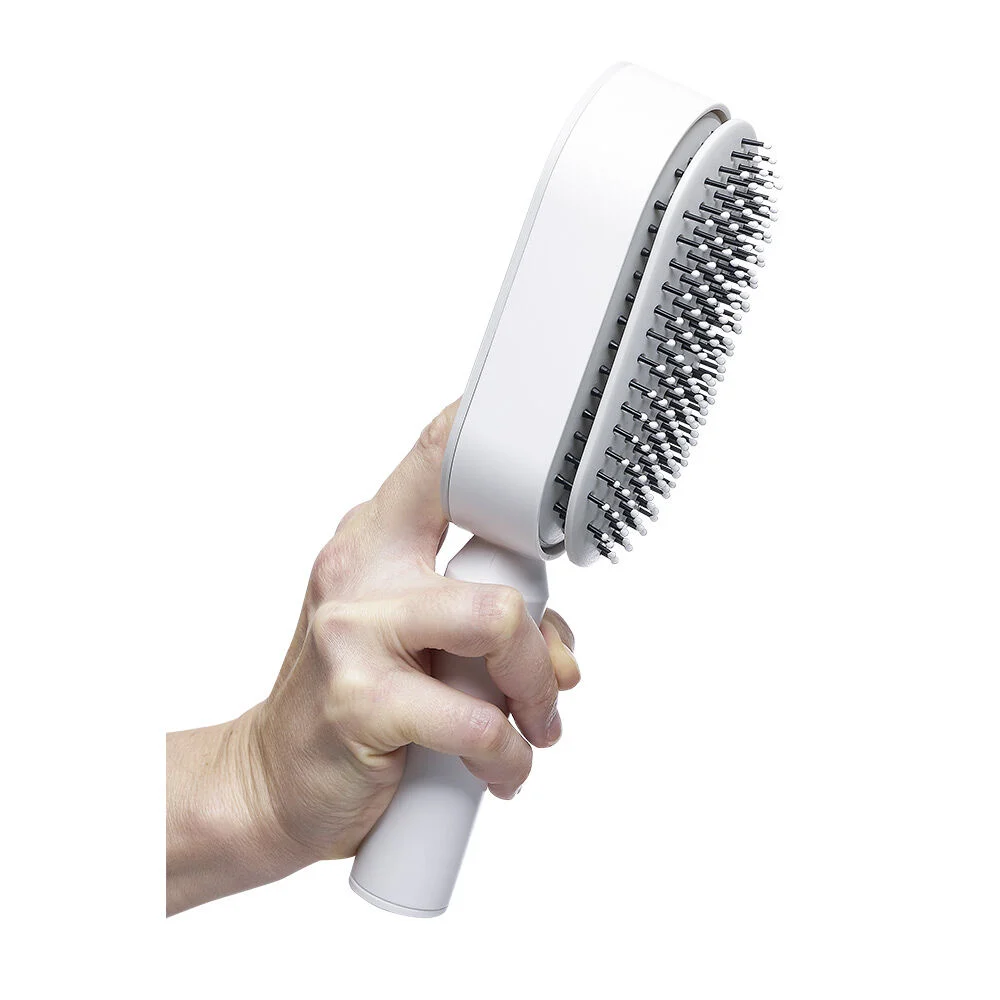Brosse à cheveux autonettoyante