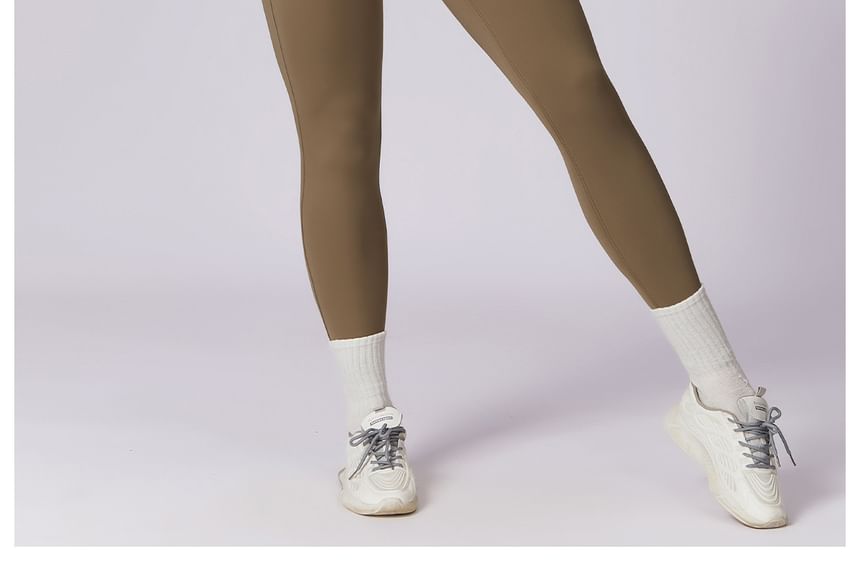 Skinniano - Sportjumpsuit met lange mouwen en halve rits