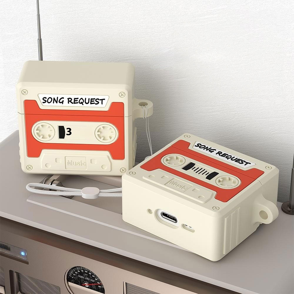 AirPods 4 Silikon Schutzhülle Abdeckung mit Handschlaufe Retro Kassette - Schwarz