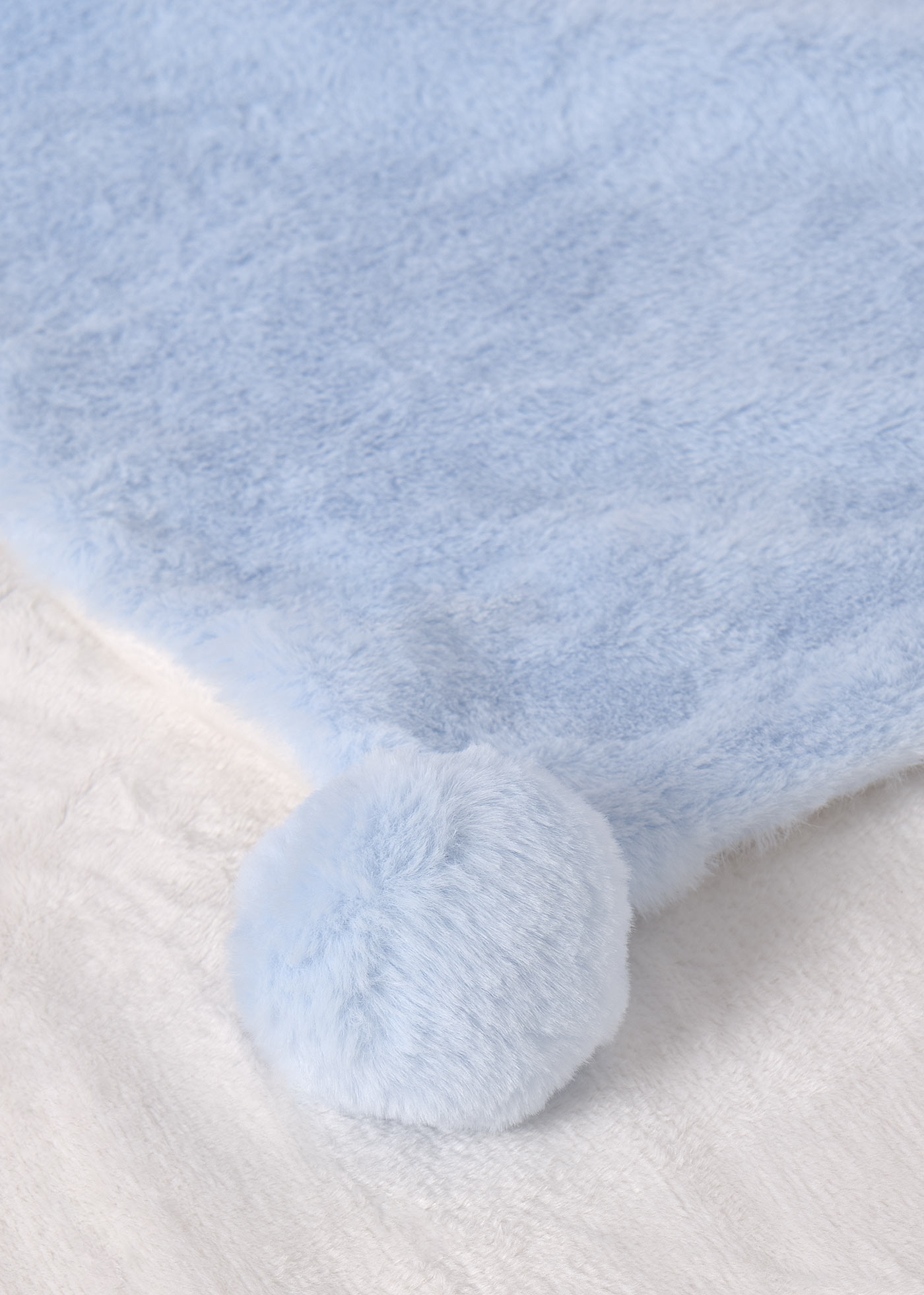 manta de bebê com pompons