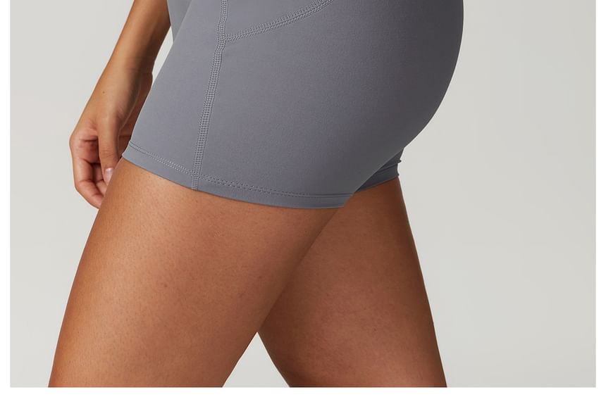 Skinniano - Yoga romper met spaghettibandjes en effen paneel