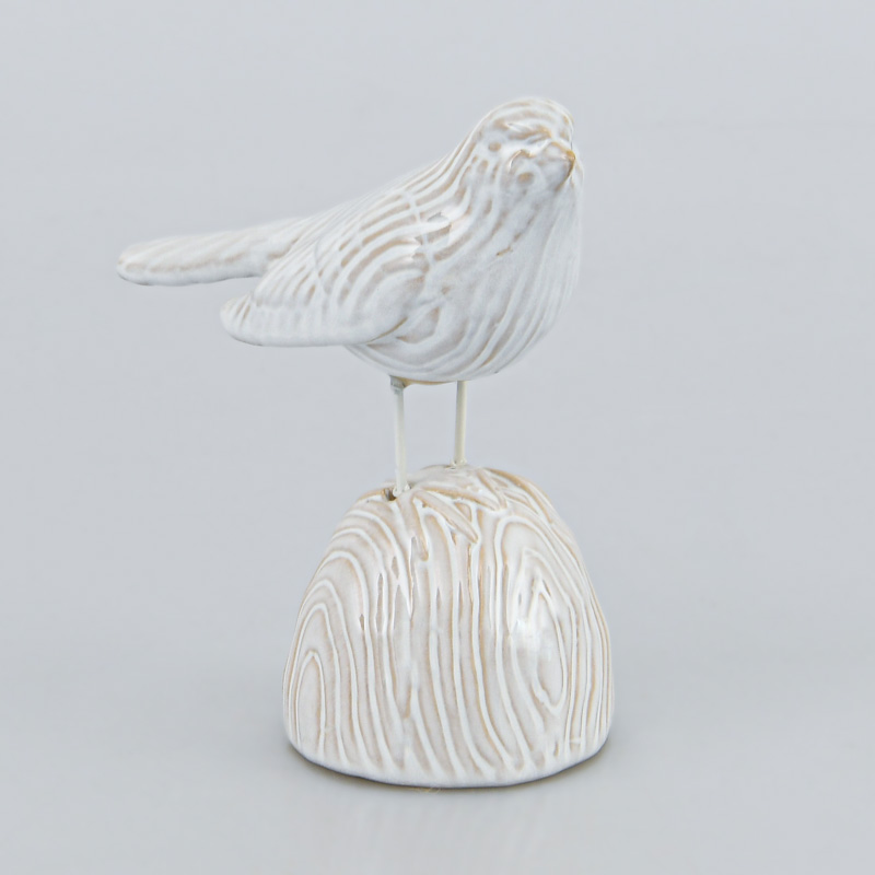 Oiseau décoratif sur support en grès crème