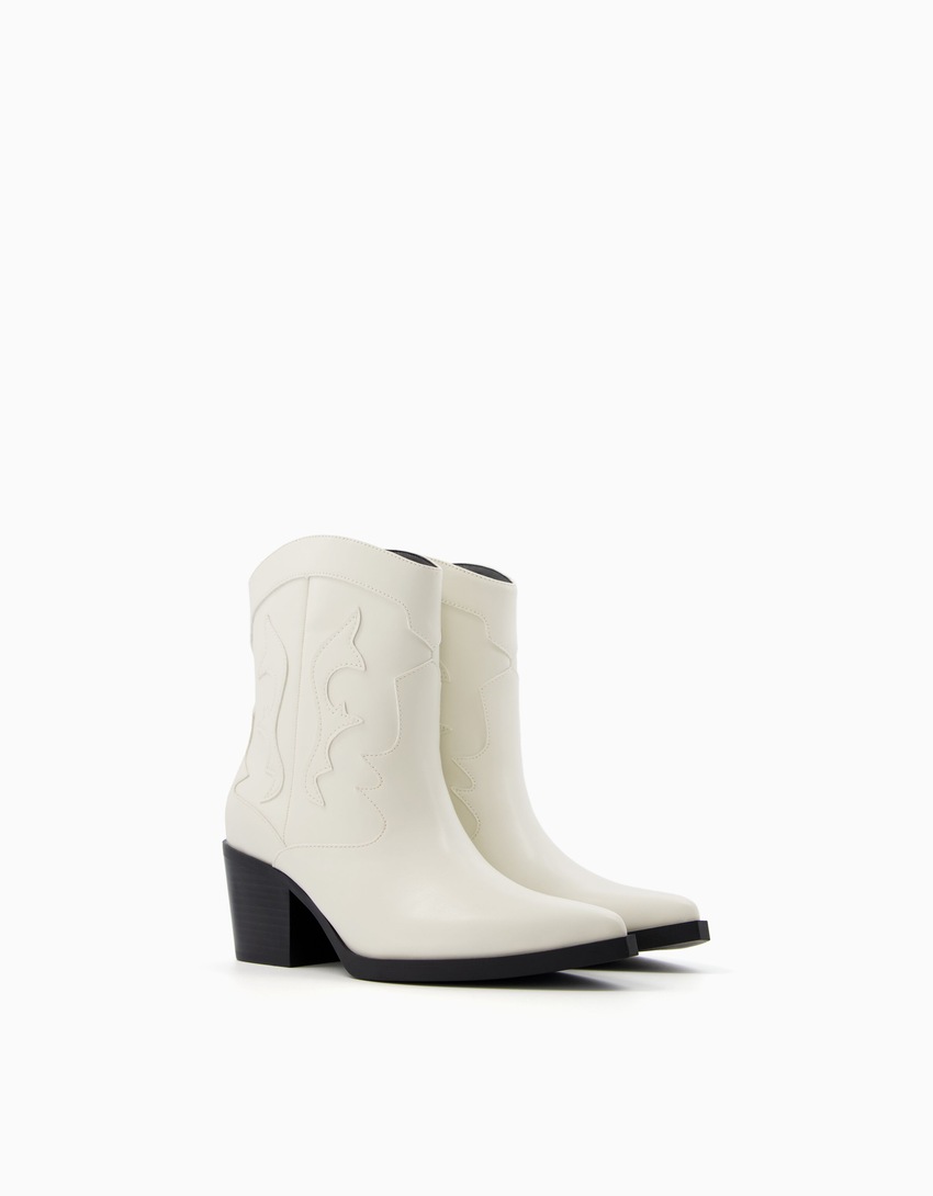 Botas de cowboy com salto alto