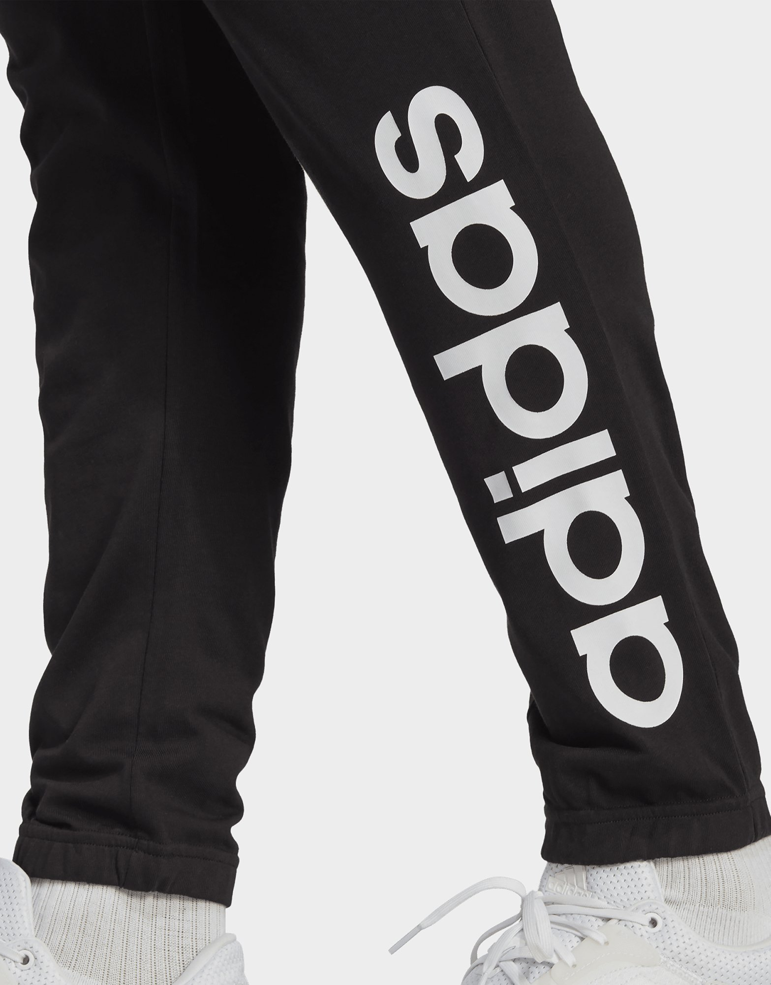 adidas Pantalon fuselé élastique en jersey avec logo Essentials