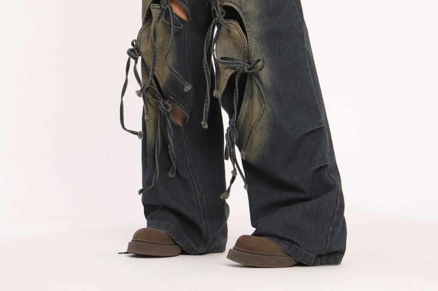 Berrytrix - Lage taille jeans met strikaccent en uitsparingen, gewassen en wijde pijpen