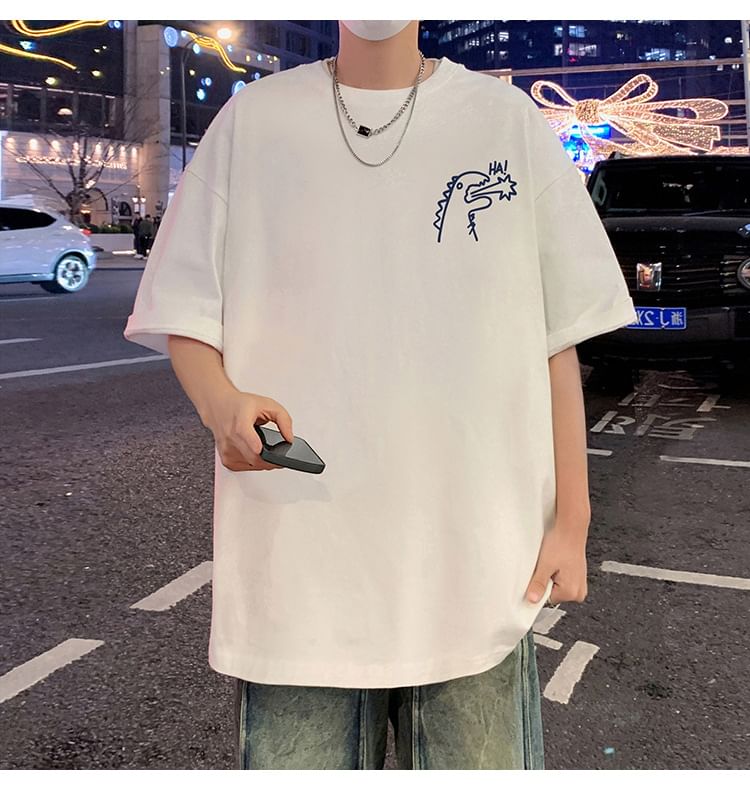 Wolfkane - Oversized T-shirt met korte mouwen, ronde hals en dinosaurusprint
