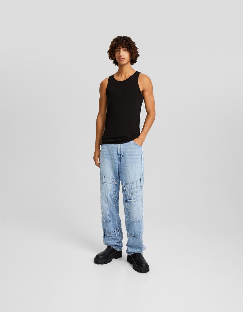 calça jeans larga com apliques