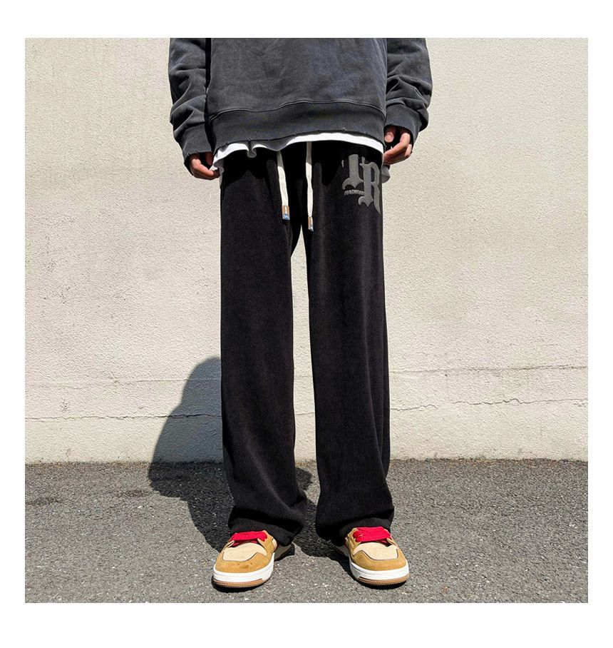 FOEV - Joggingbroek met trekkoord en letters