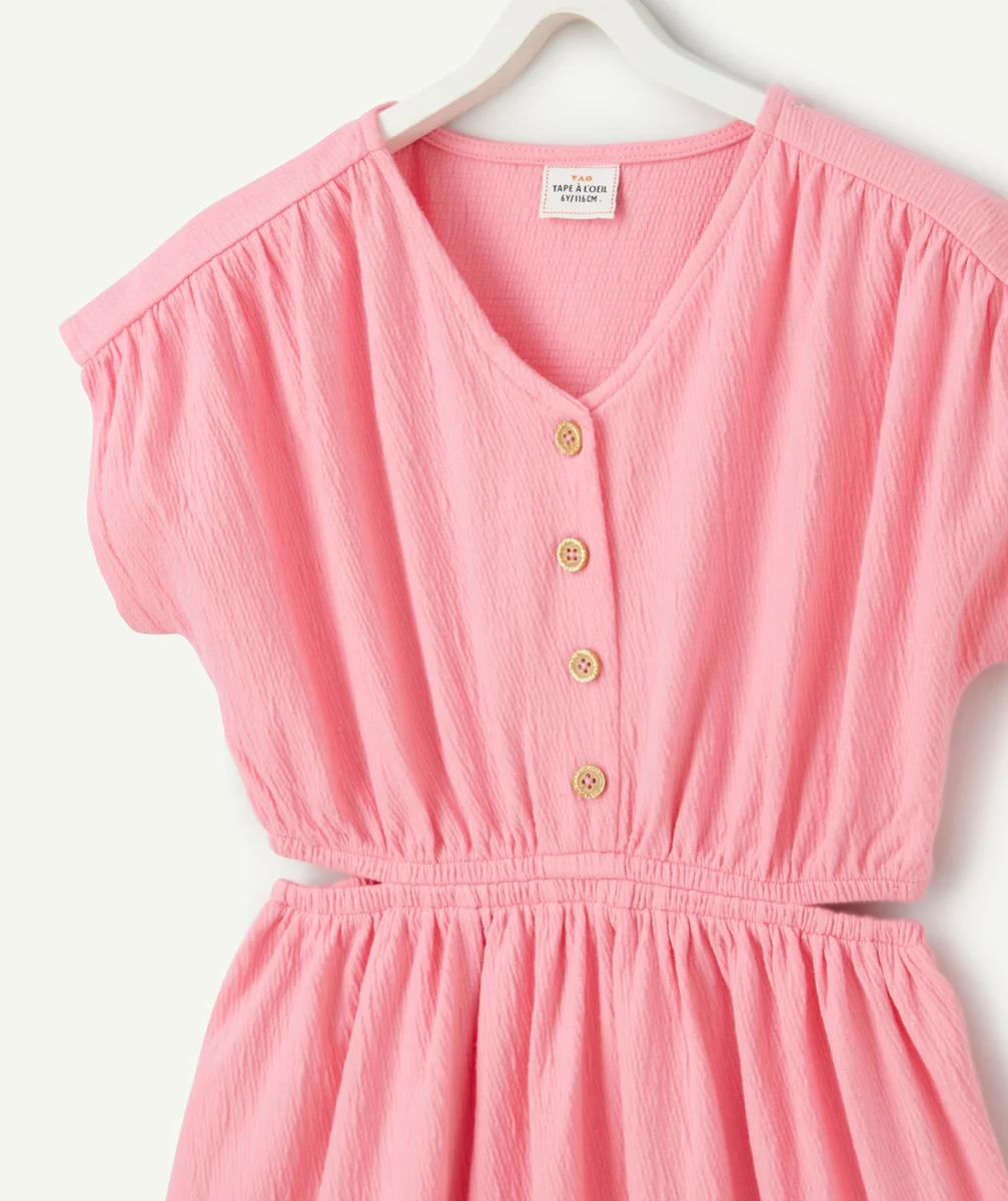 robe fille en matière gaufré rose avec ouvertures cotés