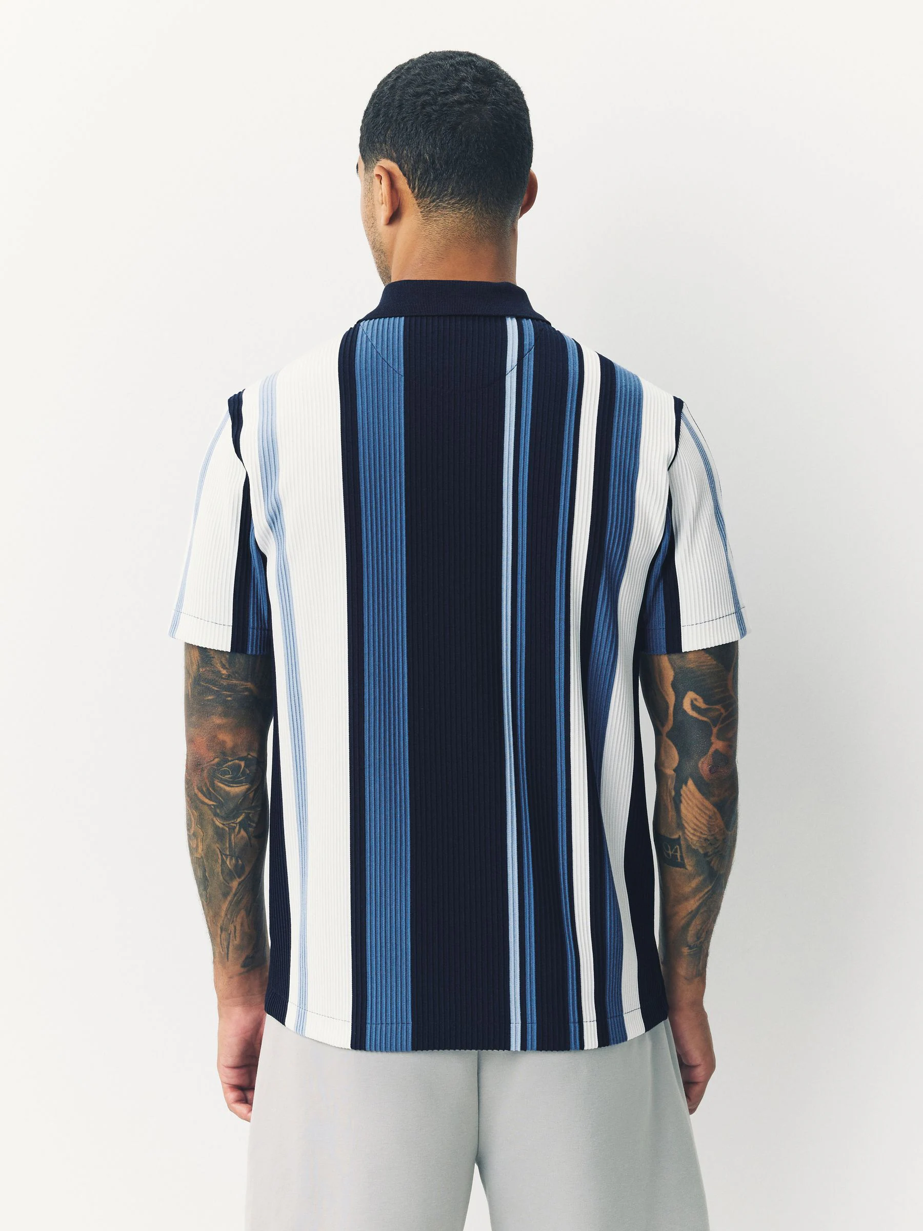 Marineblauw - Verticaal gestreepte polo met korte rits
