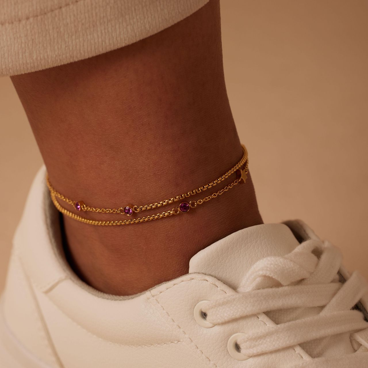 Dubbele goldplated stalen enkelbandje met steentje