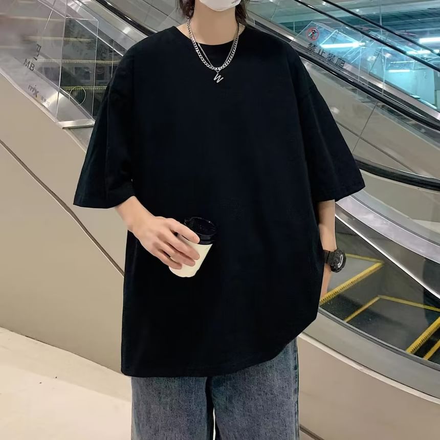 Femilina - Effen oversized T-shirt met ronde hals en elleboogmouwen