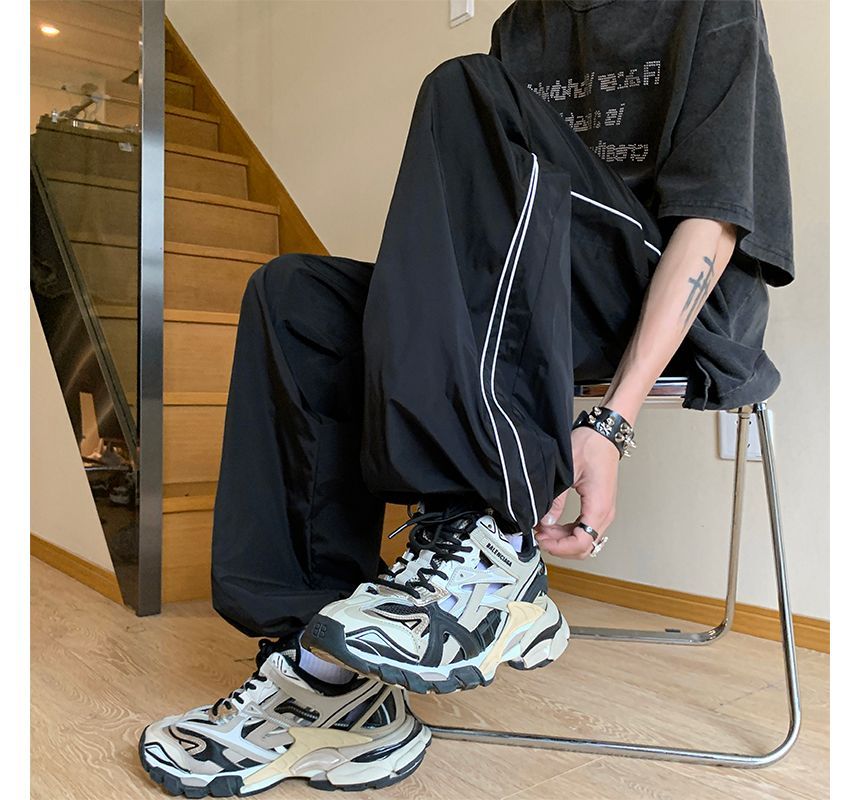 Posive - Gestreepte joggingbroek met wijde pijpen en trekkoordtaille